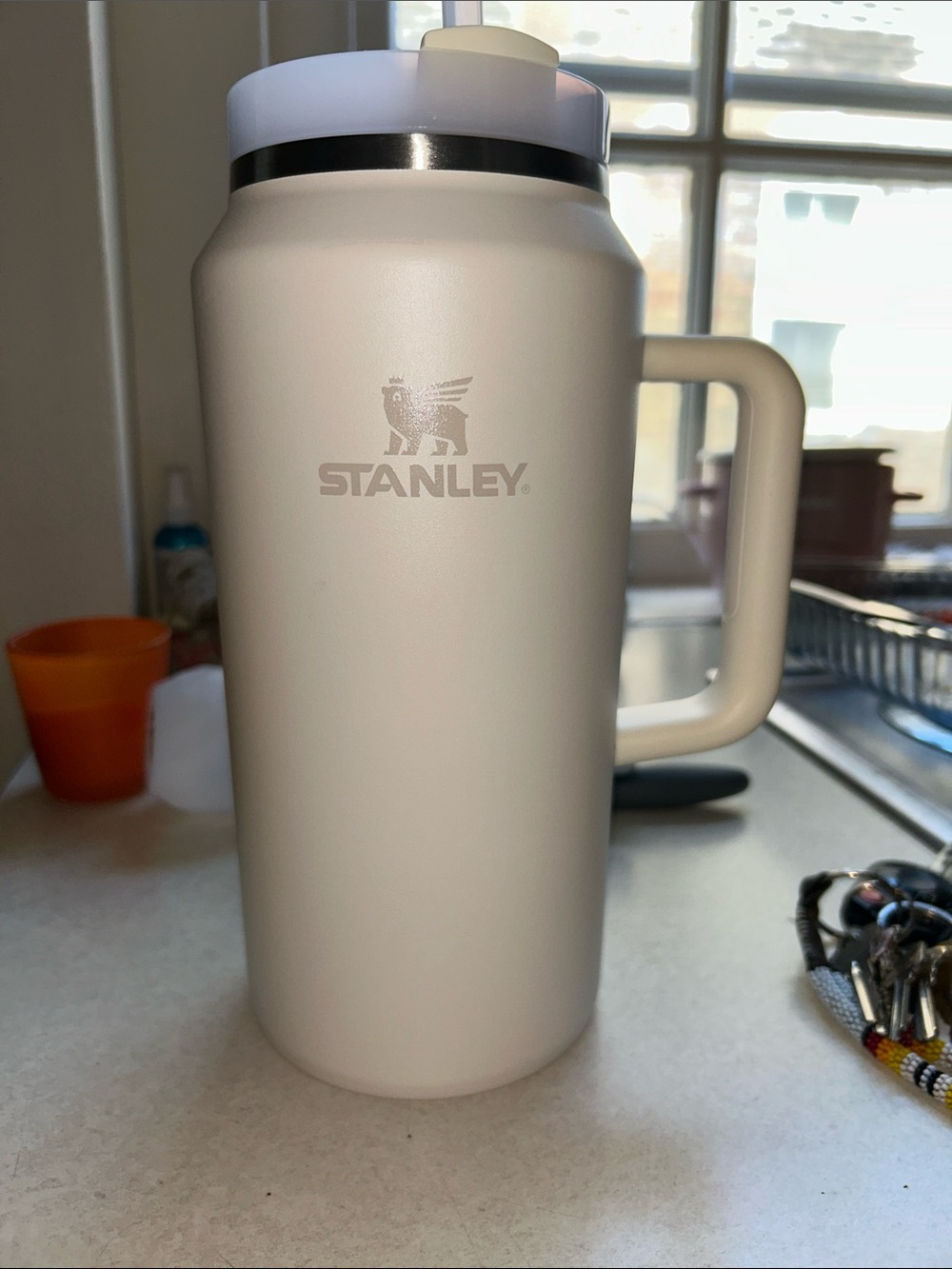 Stanley Matte Cream Travel Mug with Handle and Silver Trim